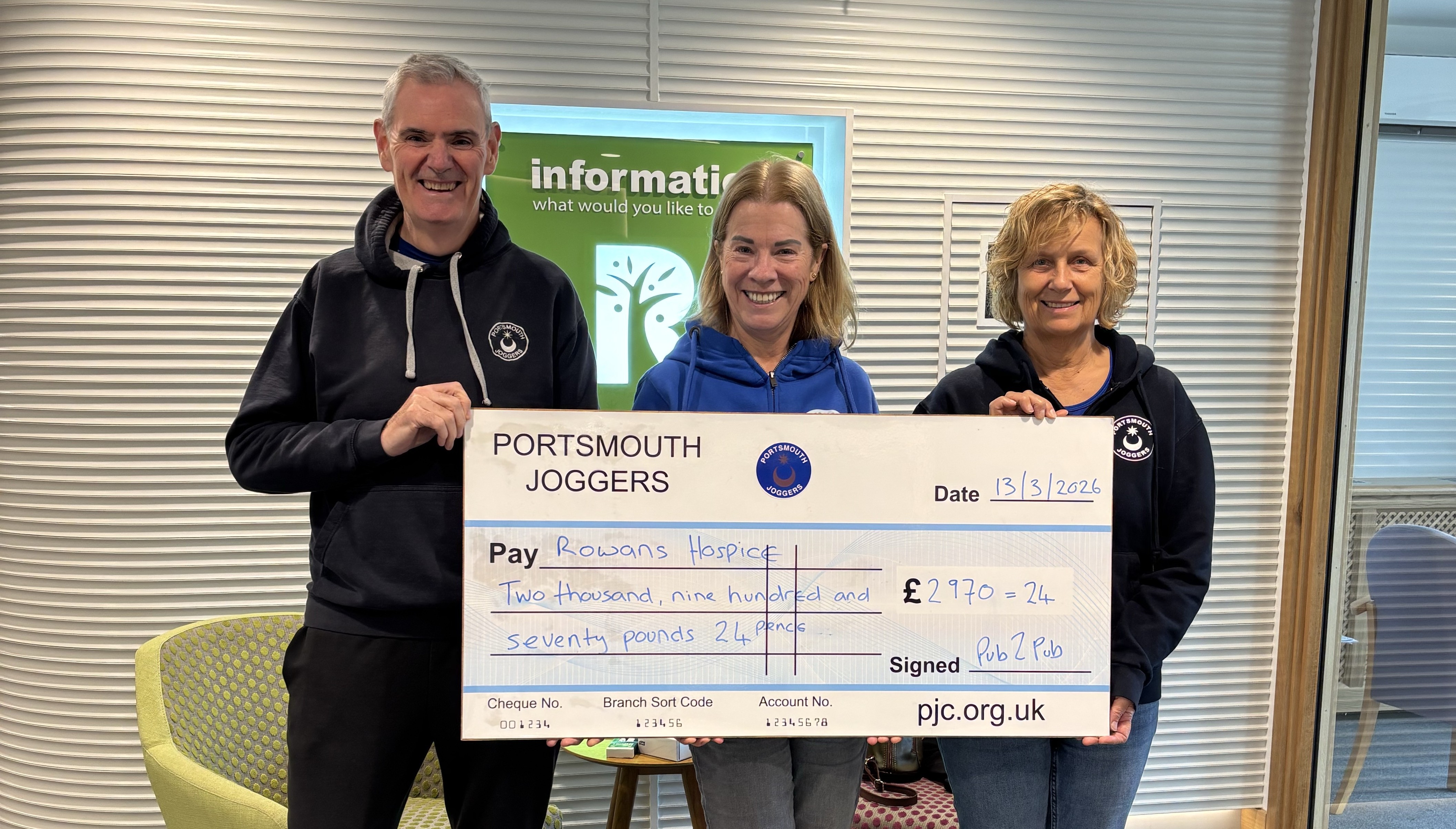 Tony and Sue presenting a cheque to Rowans Hospice